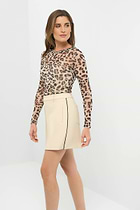 Side view of a skort with a black side stripe, paired with a cheetah-print long-sleeve top.