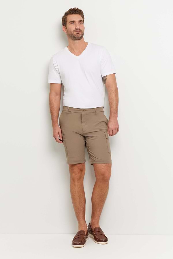 The Best Travel Shorts. Man Showing the Front Profile of a Men's Randy Short in Khaki.