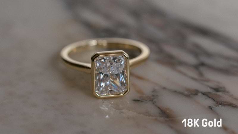 18K gold bezel set radiant engagement ring