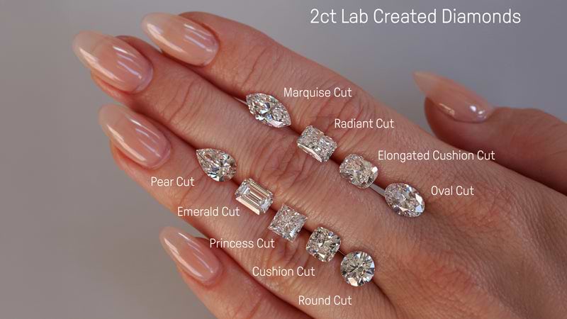 Loose 2ct Diamonds In Different Shapes On Hand