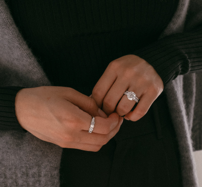 radiant cut diamond wedding and engagement ring on a woman's hand