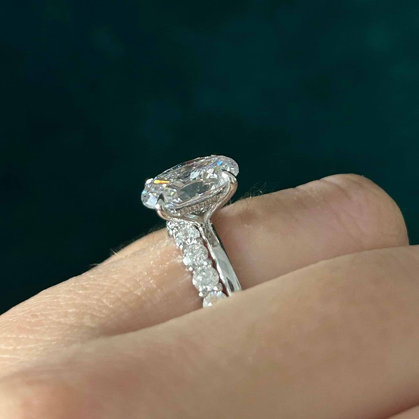 oval hidden halo engagement ring