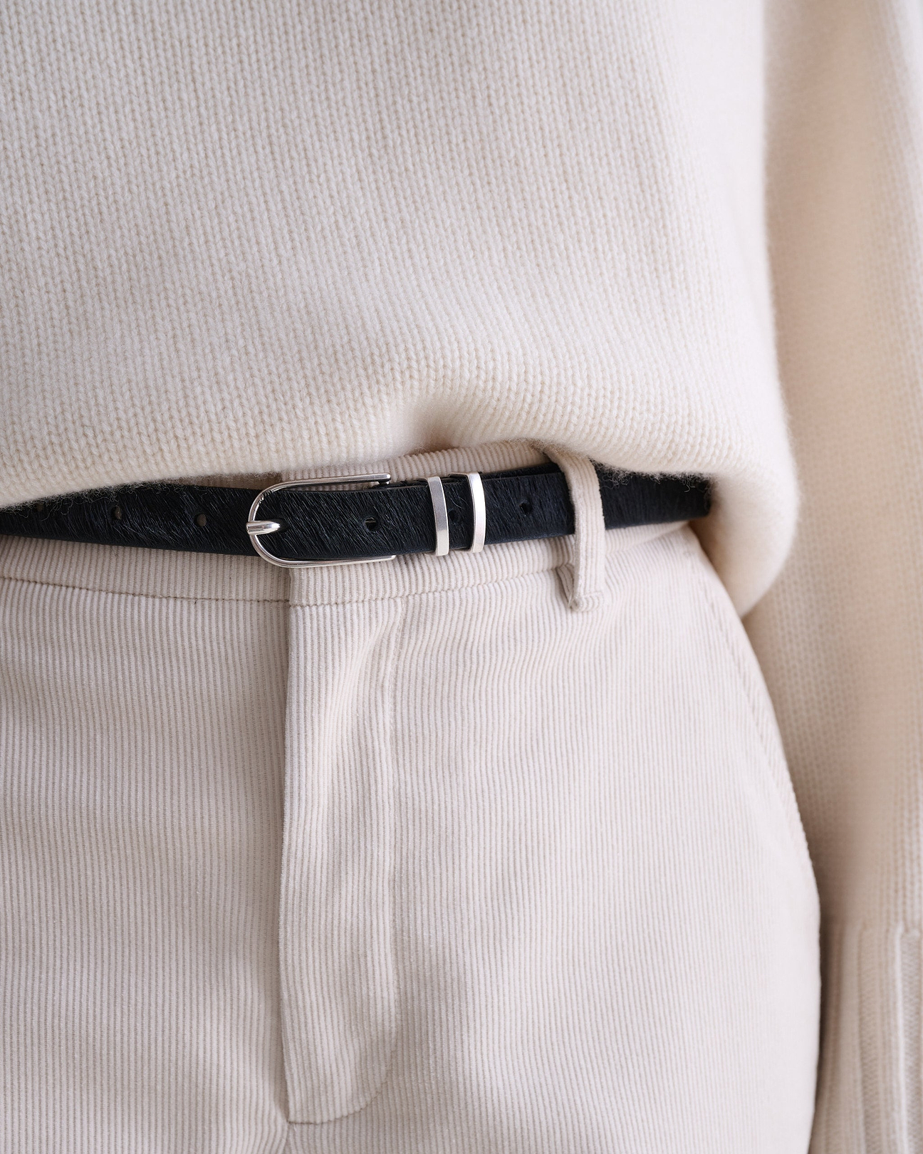 Single-prong buckle and double belt keeper detail