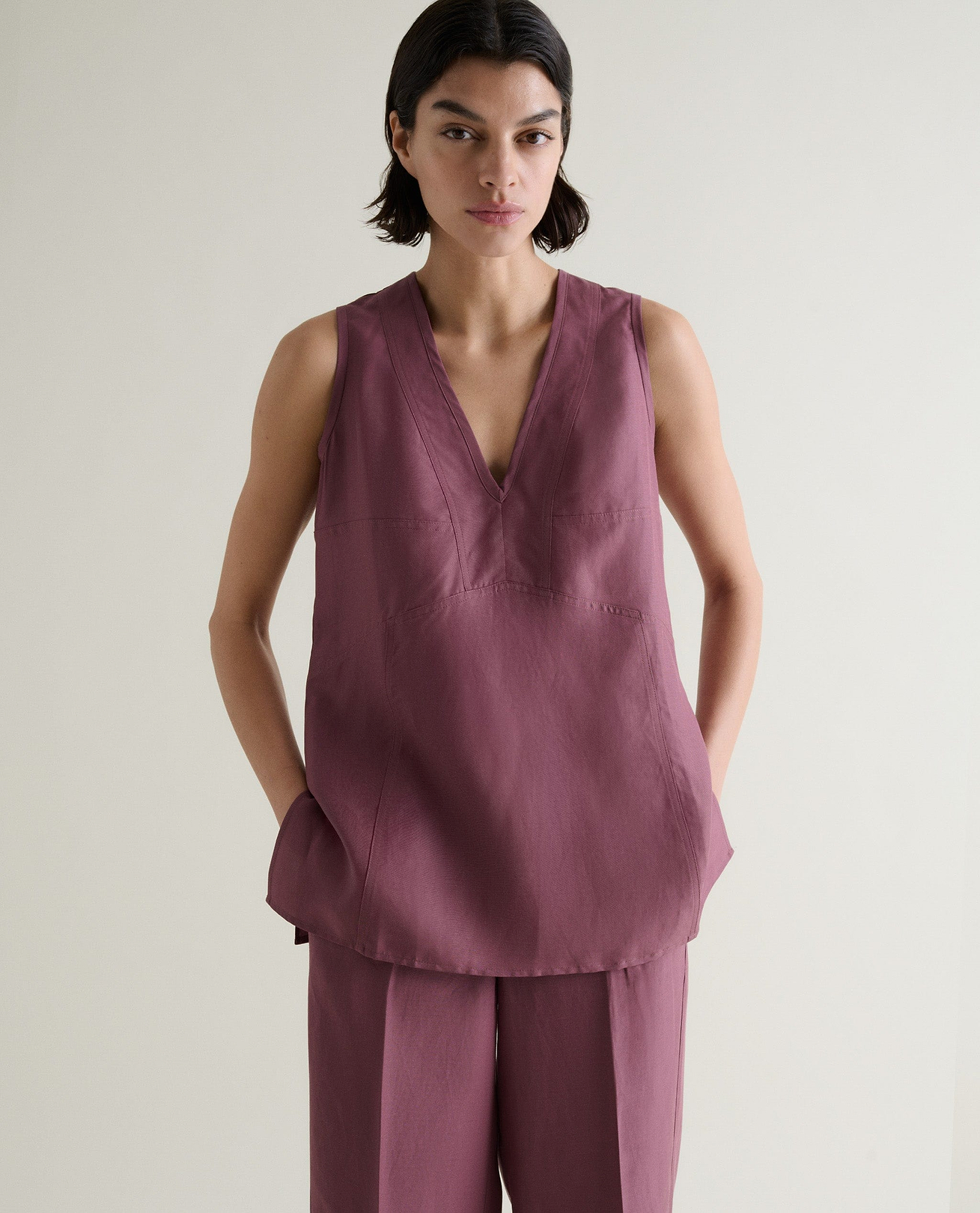 Fitted at bust, gently flaring at hem.