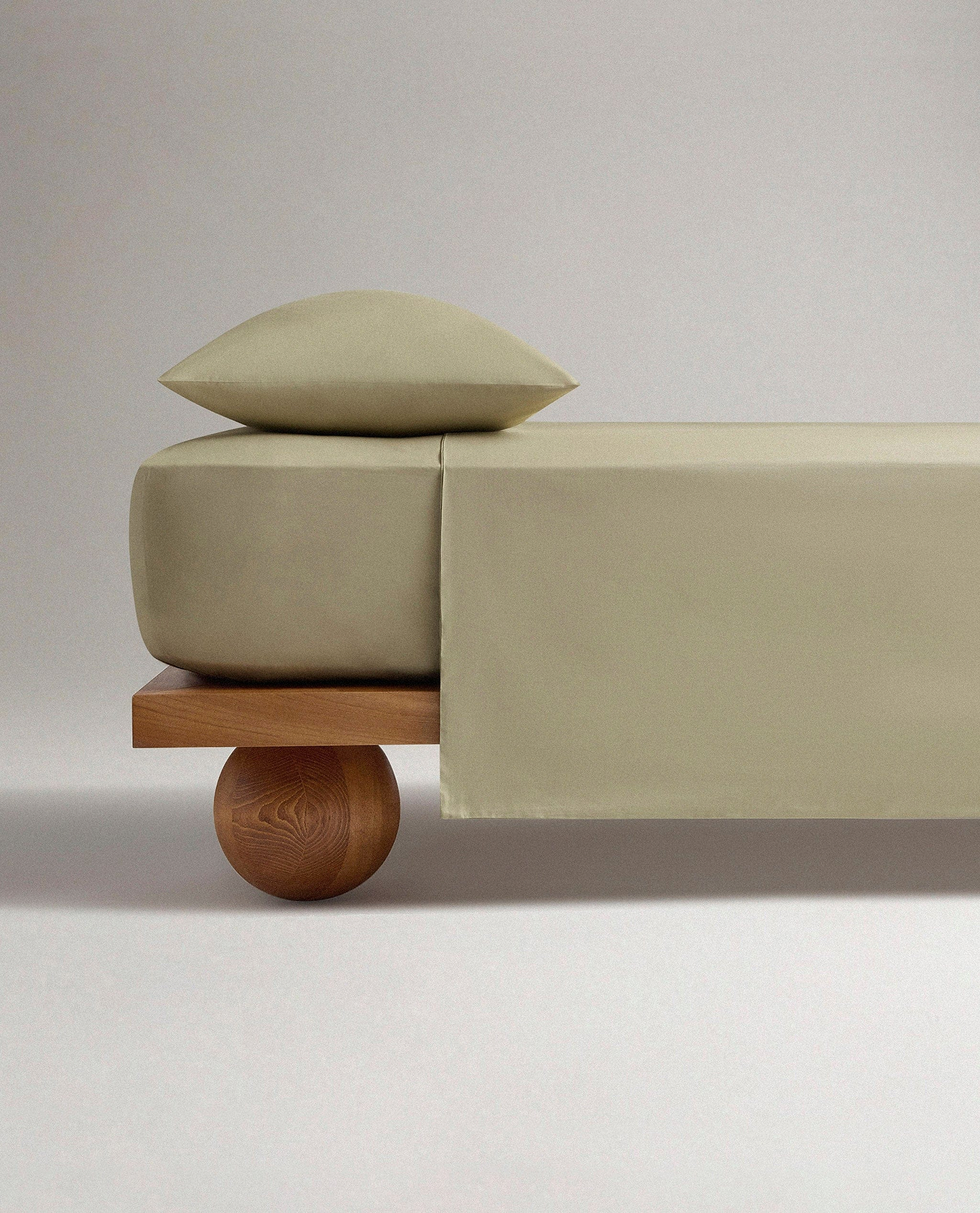 Image 1 of 4 showing Rise & Fall's Crisp & Cool organic percale cotton flat sheet in sage.