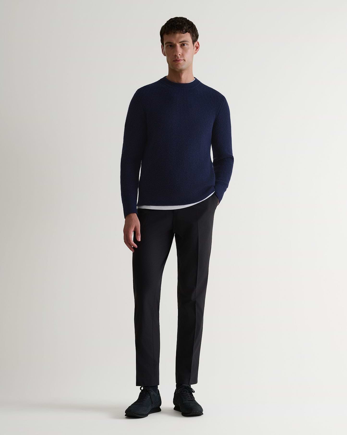 Image 1 of 6 showing man wearing Rise & Fall's Cashmere Merino Fishermans Rib Crew Neck Jumper in navy.