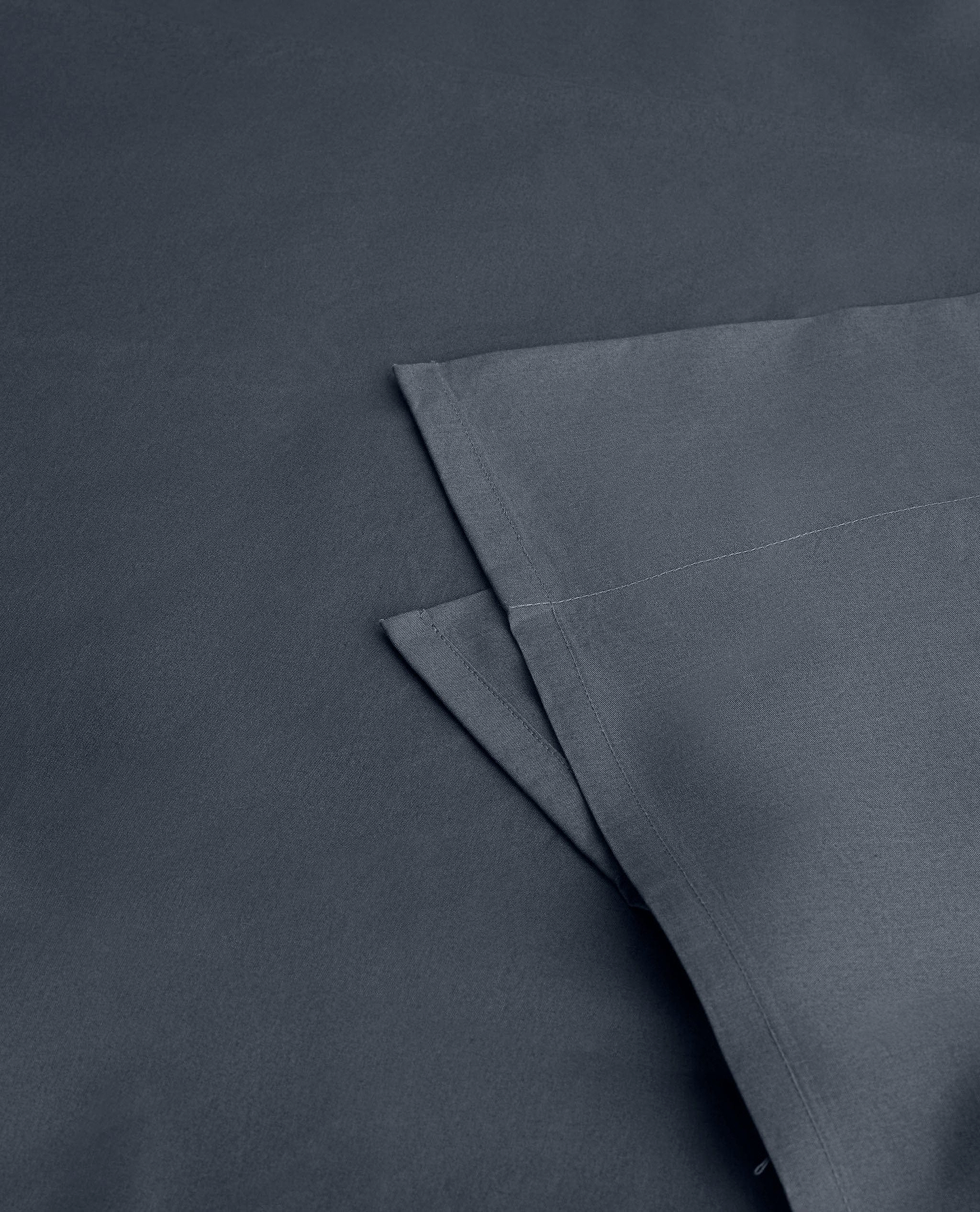 Image 2 of 4 showing Rise & Fall's Soft & Smooth organic sateen cotton flat sheet in mood indigo. 