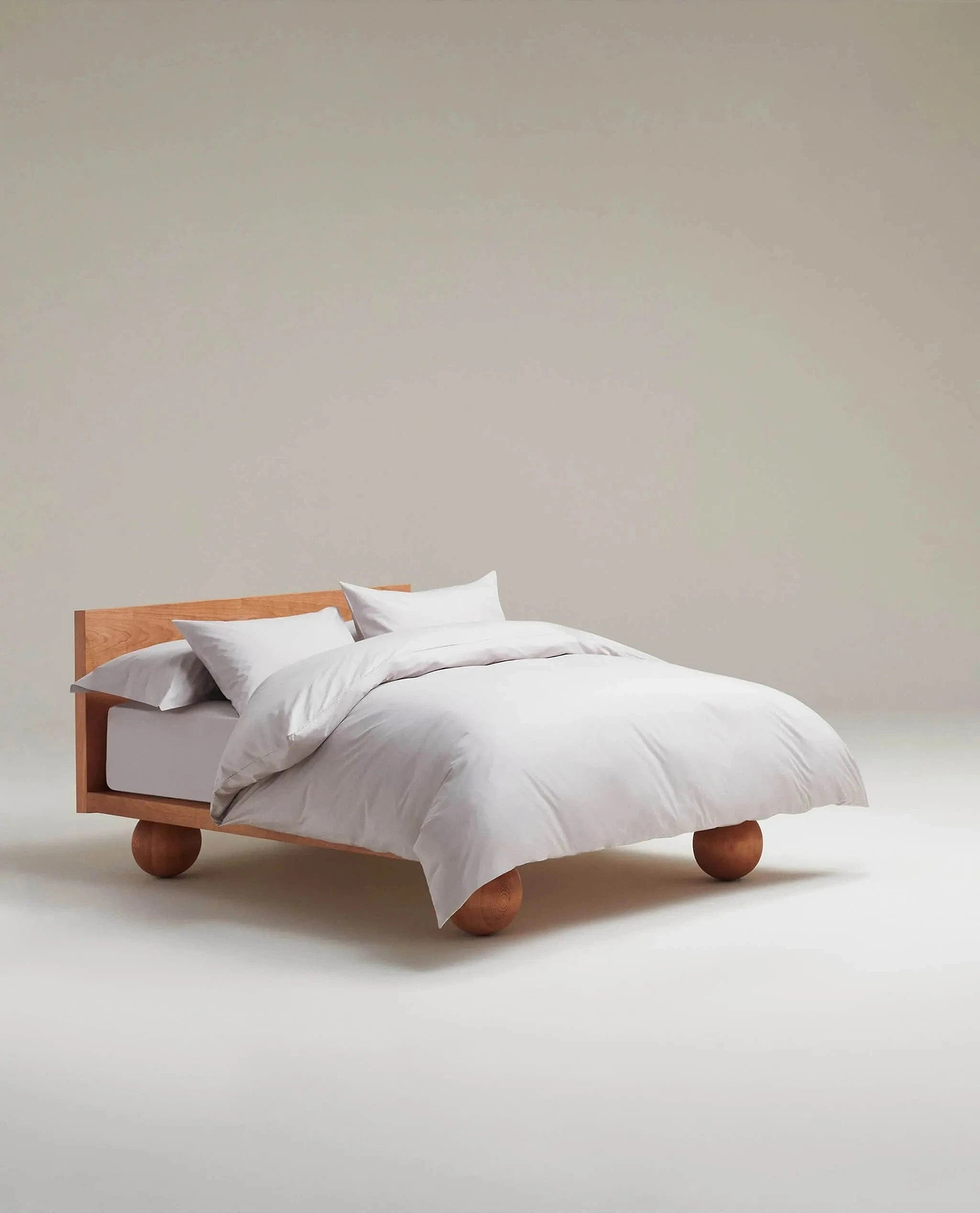 image 2 of 5 showing bed made with Rise & Fall's pebble crisp & cool duvet set in percale cotton