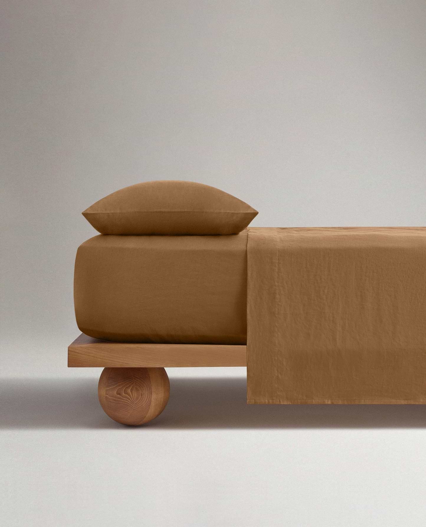 Image 2 of 5 showing Rise & Fall's Relaxed & Refined European flax™ linen fitted sheet in ochre.