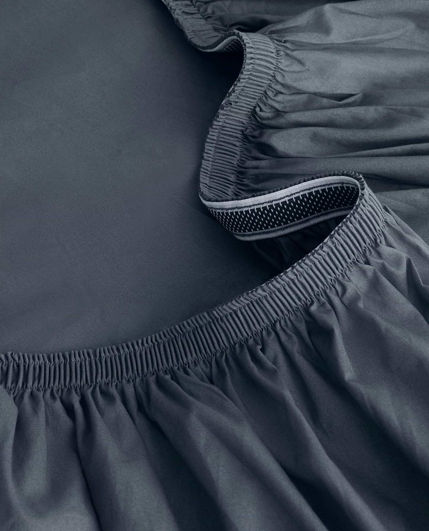 Image 2 of 6 showing Rise & Fall's Soft & Smooth sateen cotton deep fitted sheet in indigo.