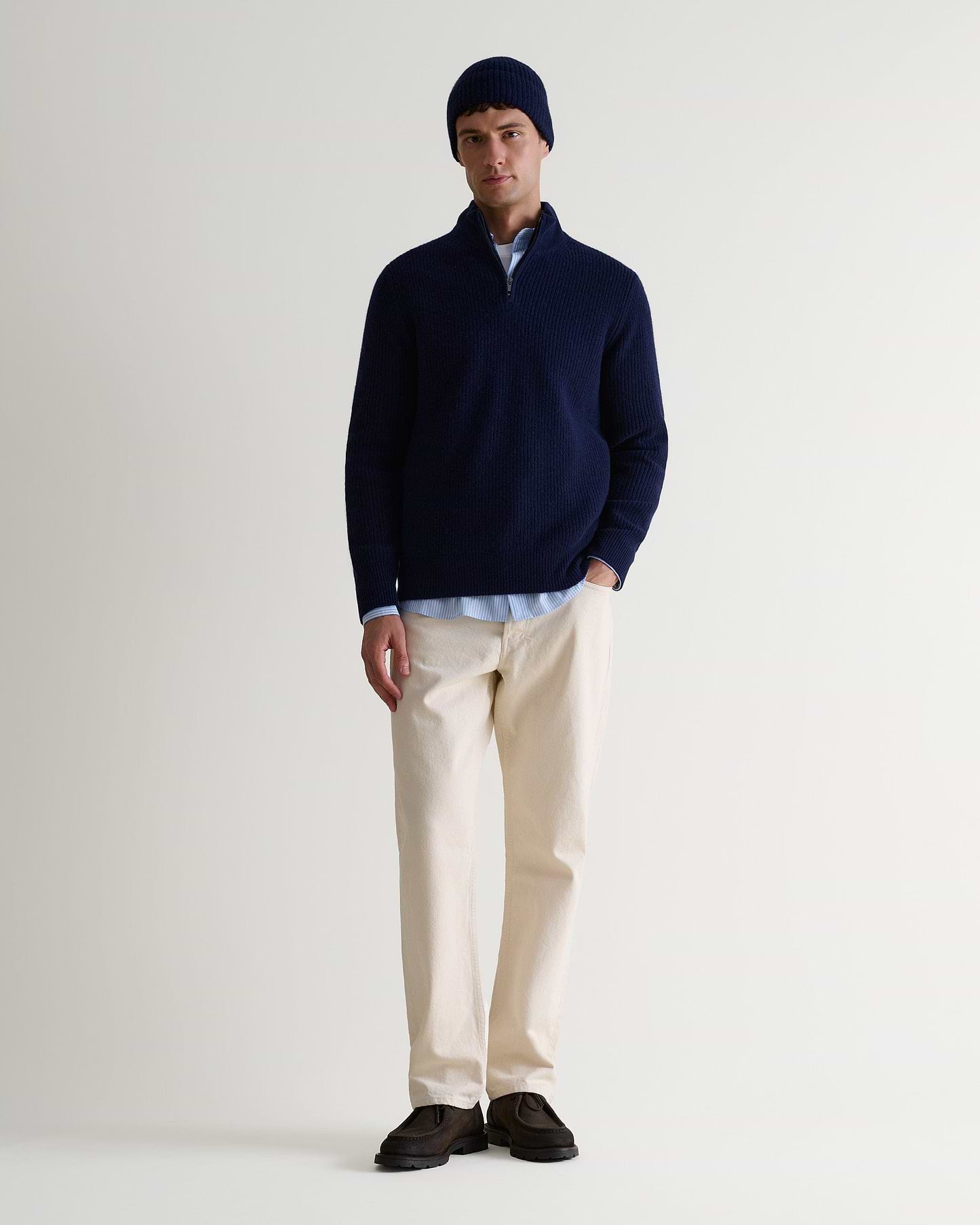 Image 3 of 3 showing man wearing Rise & Fall's Cashmere Merino Ribbed Knit Beanie in navy.