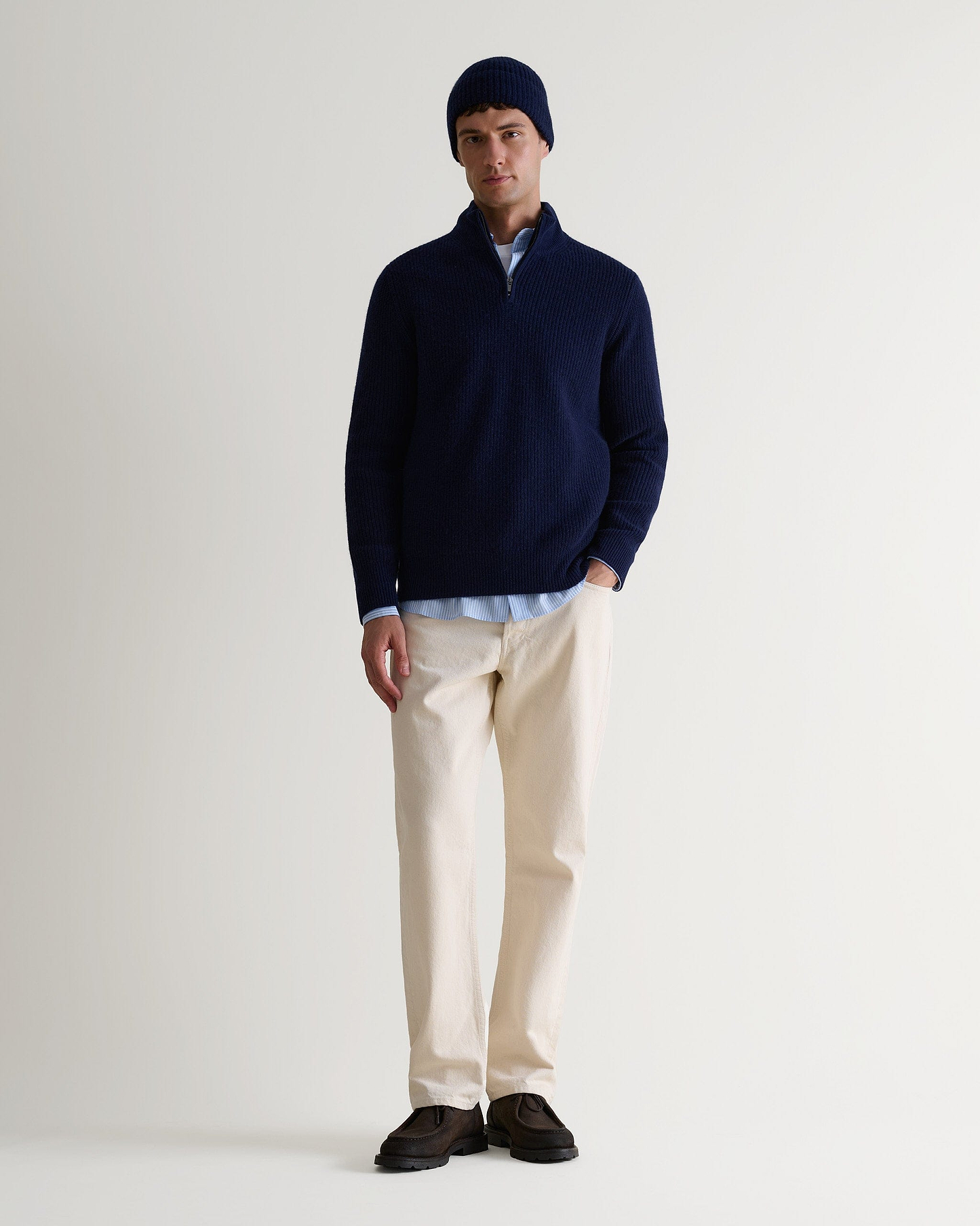 Image 3 of 3 showing man wearing Rise & Fall's Cashmere Merino Ribbed Knit Beanie in navy.