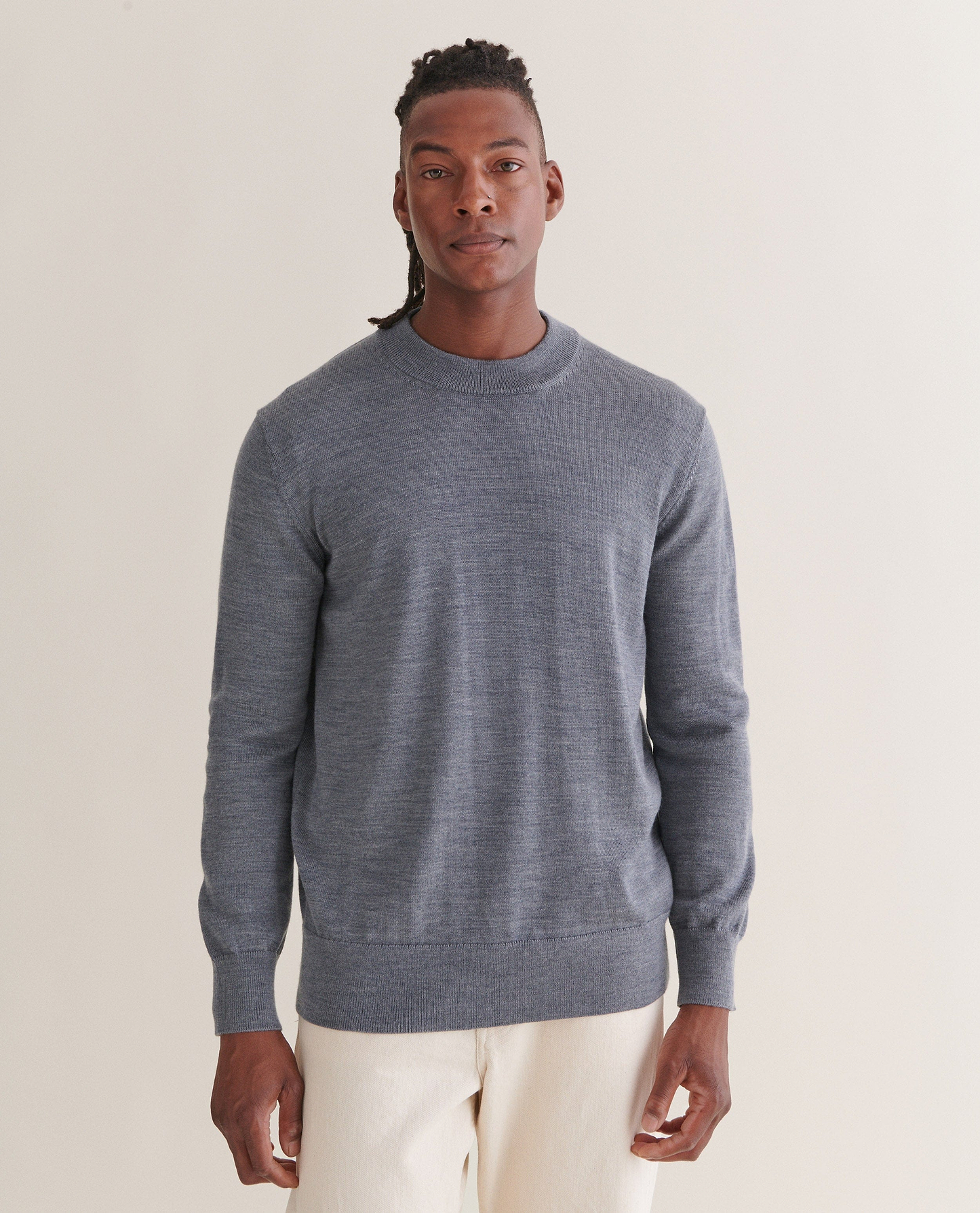 Image 3 of 4 showing man wearing Rise & Fall's merino mid-weight crew neck jumper in grey.