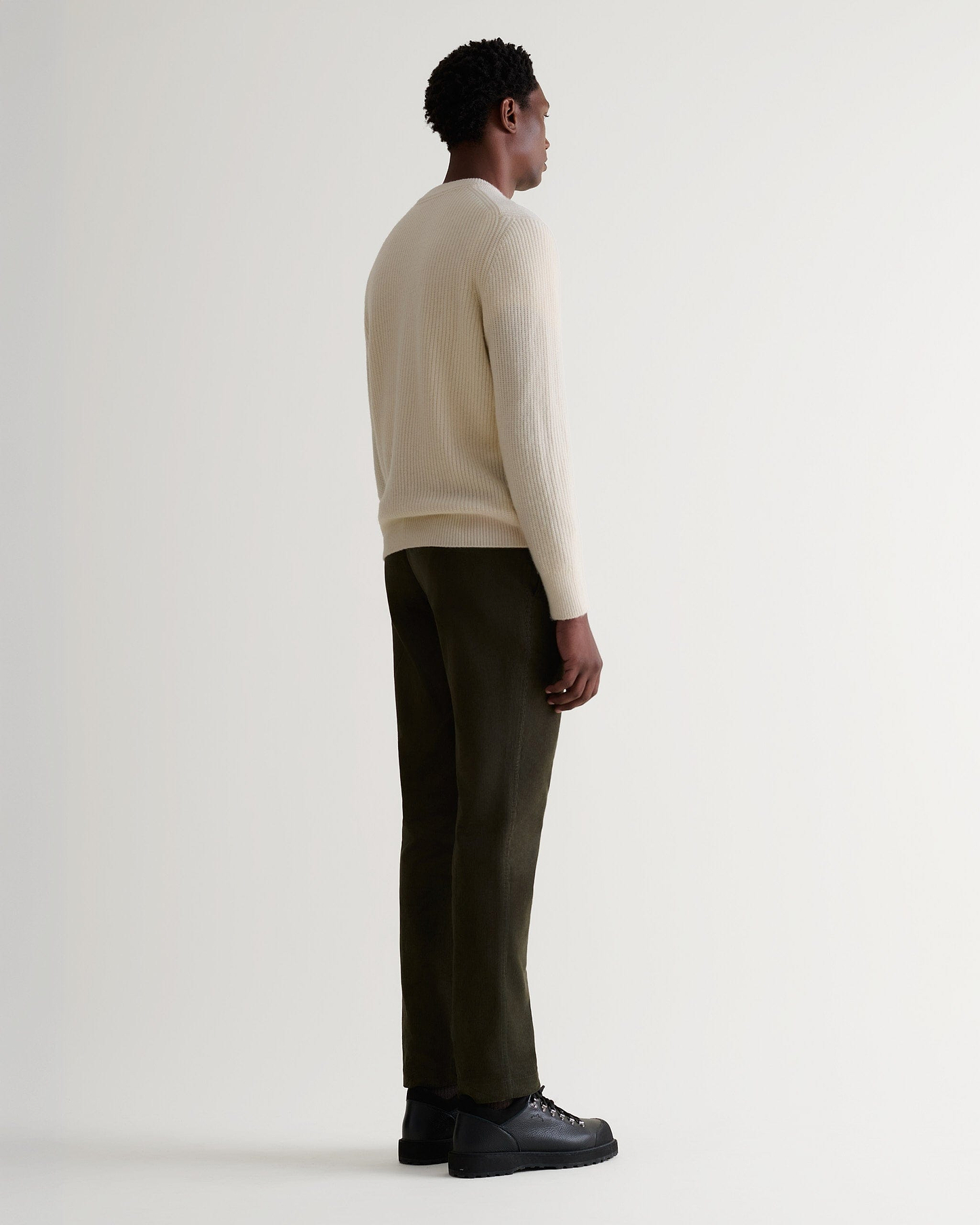 Image 3 of 5 showing man wearing Rise & Fall's Cashmere Merino Fishermans Rib Crew Neck Jumper in cream.