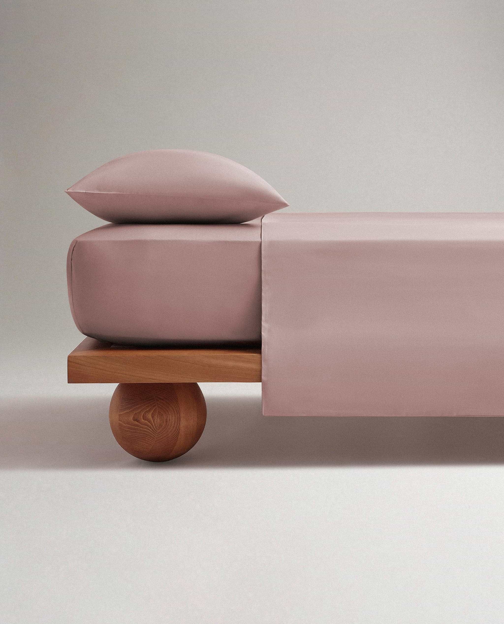 Image 3 of 6 showing bed made with Rise & Fall's Crisp & Cool organic cotton duvet set in clay.