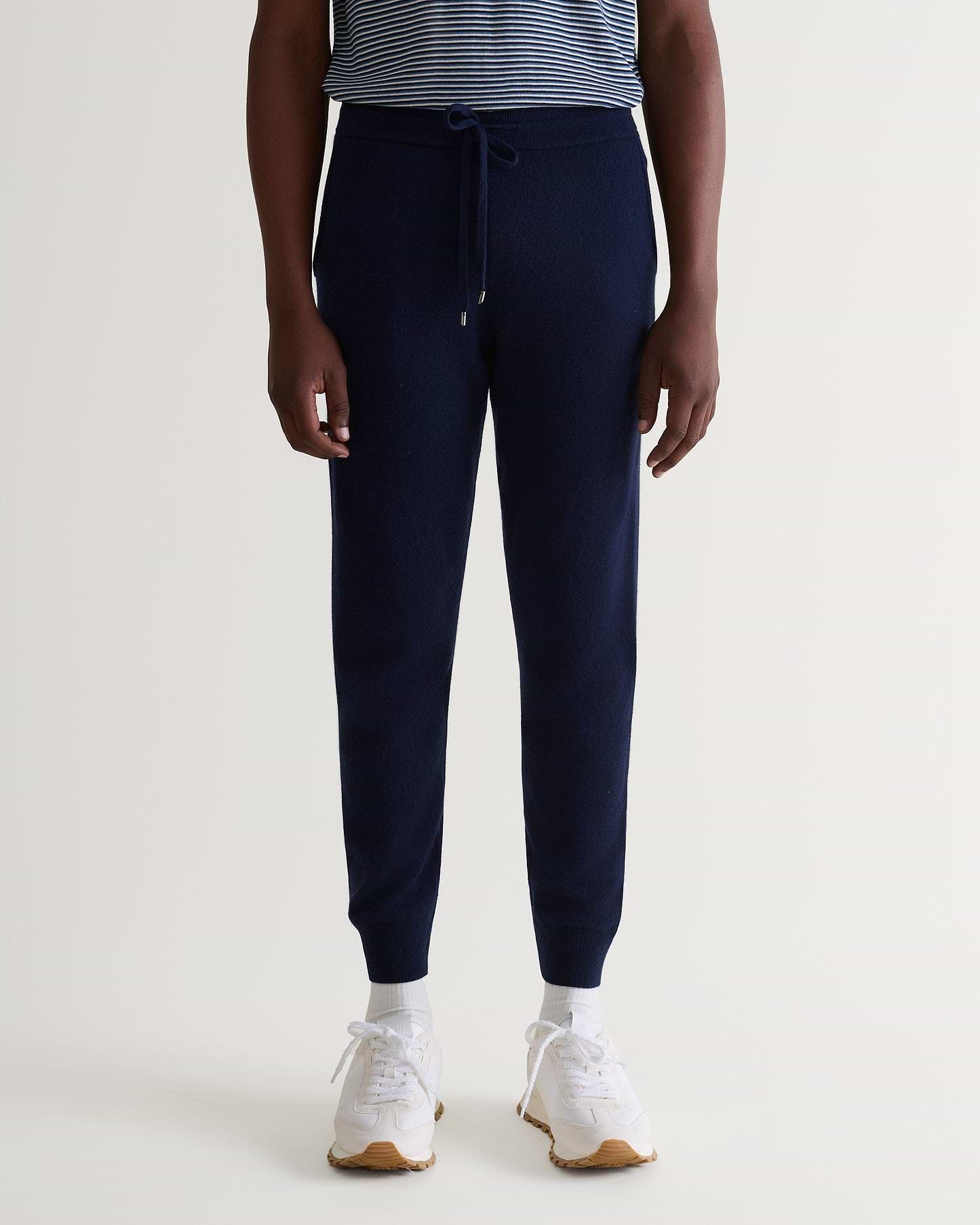 Image 4 of 5 showing man wearing Rise & Fall's fine cashmere jogger, navy.