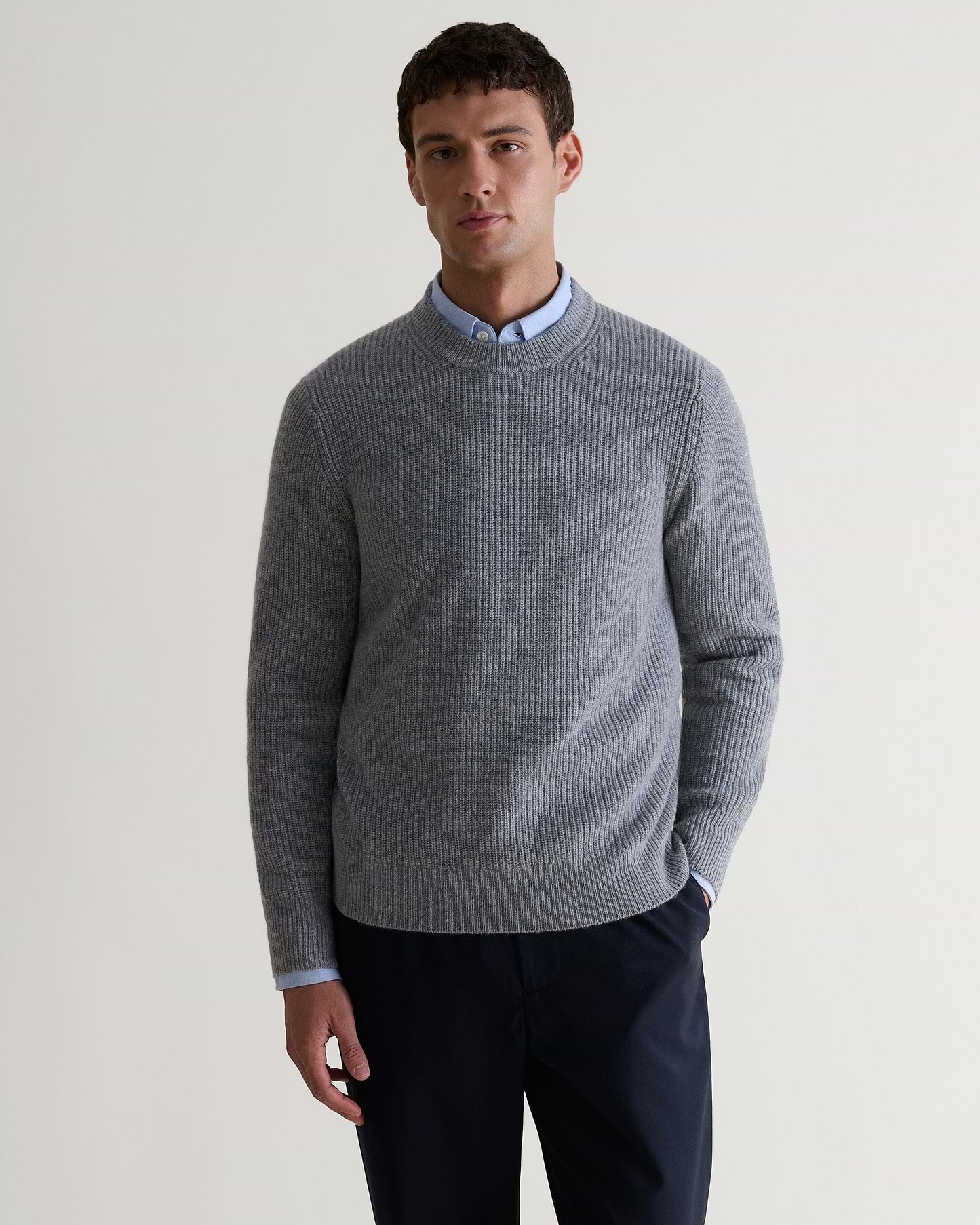 Image 4 of 5 showing man wearing Rise & Fall's Cashmere Merino Fishermans Rib Crew Neck Jumper in grey.