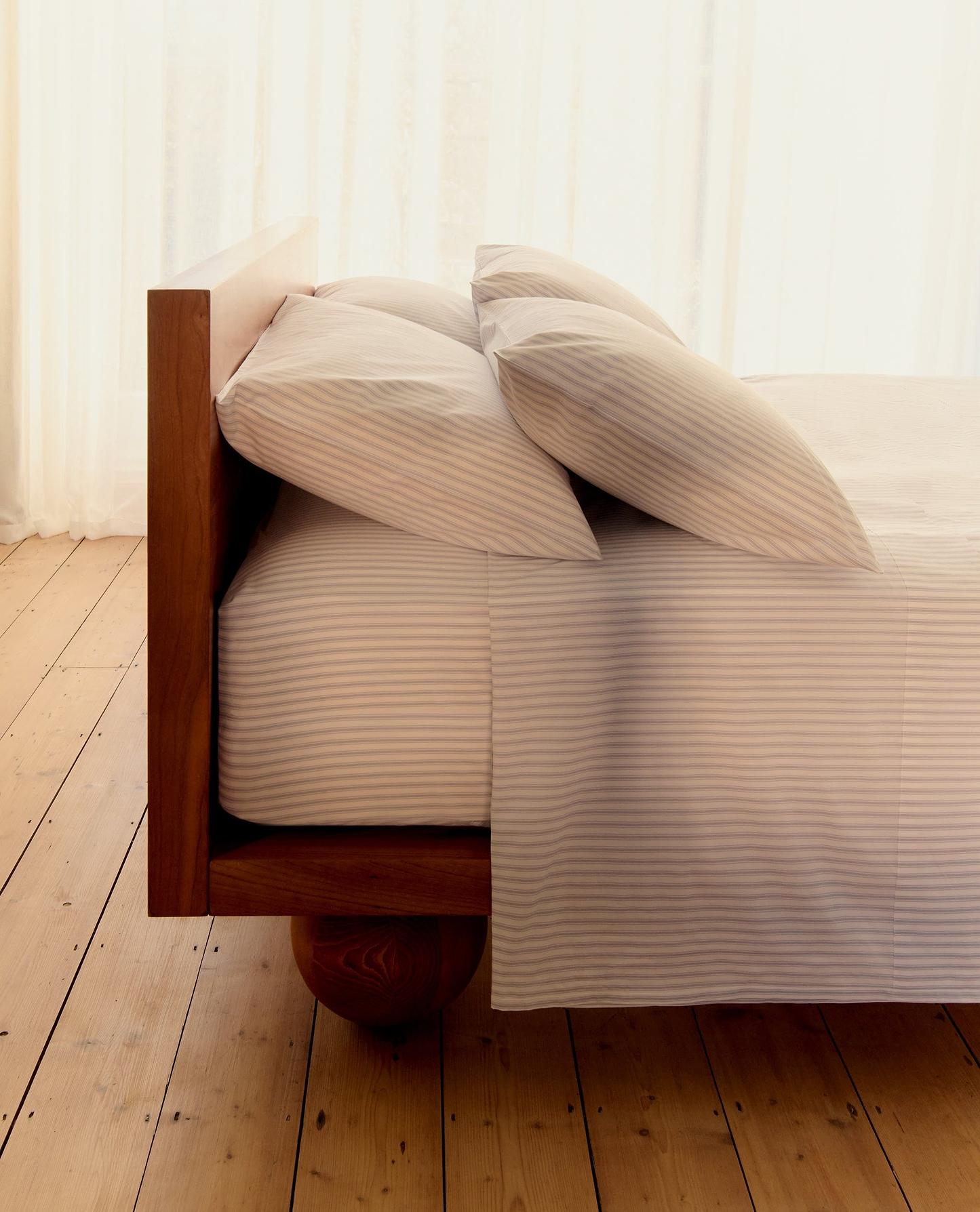 Image 4 of 5 showing Rise & Fall's Crisp & Cool organic percale cotton duvet set in blue ticking stripe.