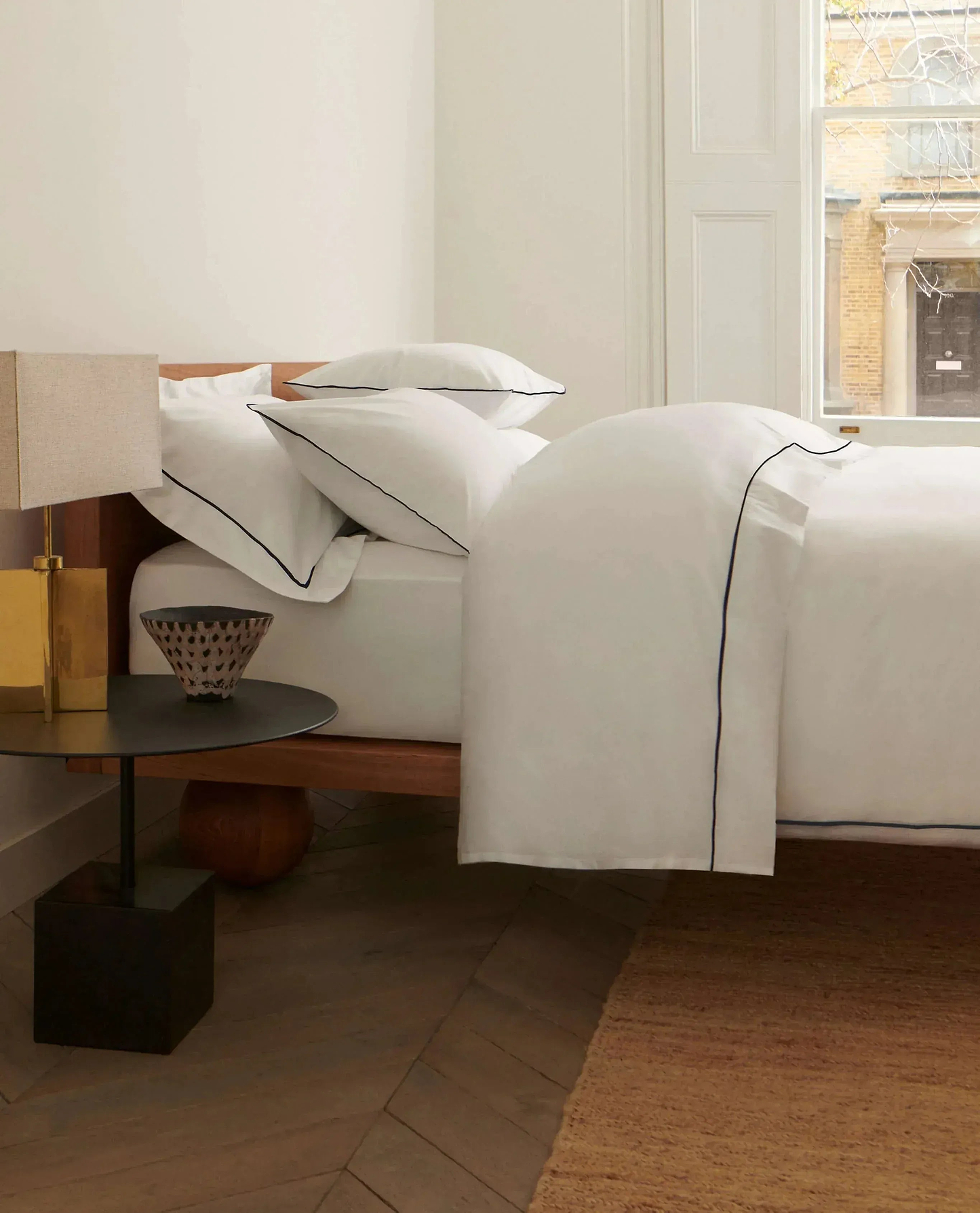 Image 4 of 5 showing Rise & Fall's percale cotton duvet cover, colour: white navy piping.