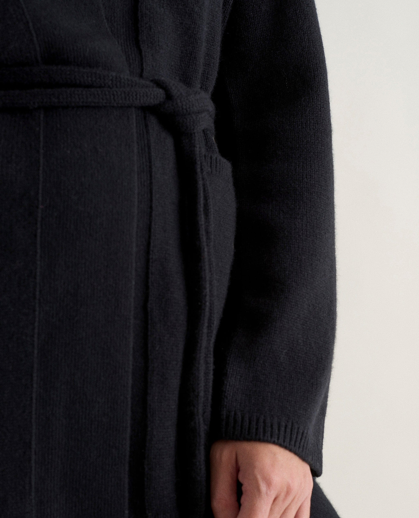 Image 4 of 5 showing Rise & Fall's black cashmere merino belted cardigan.