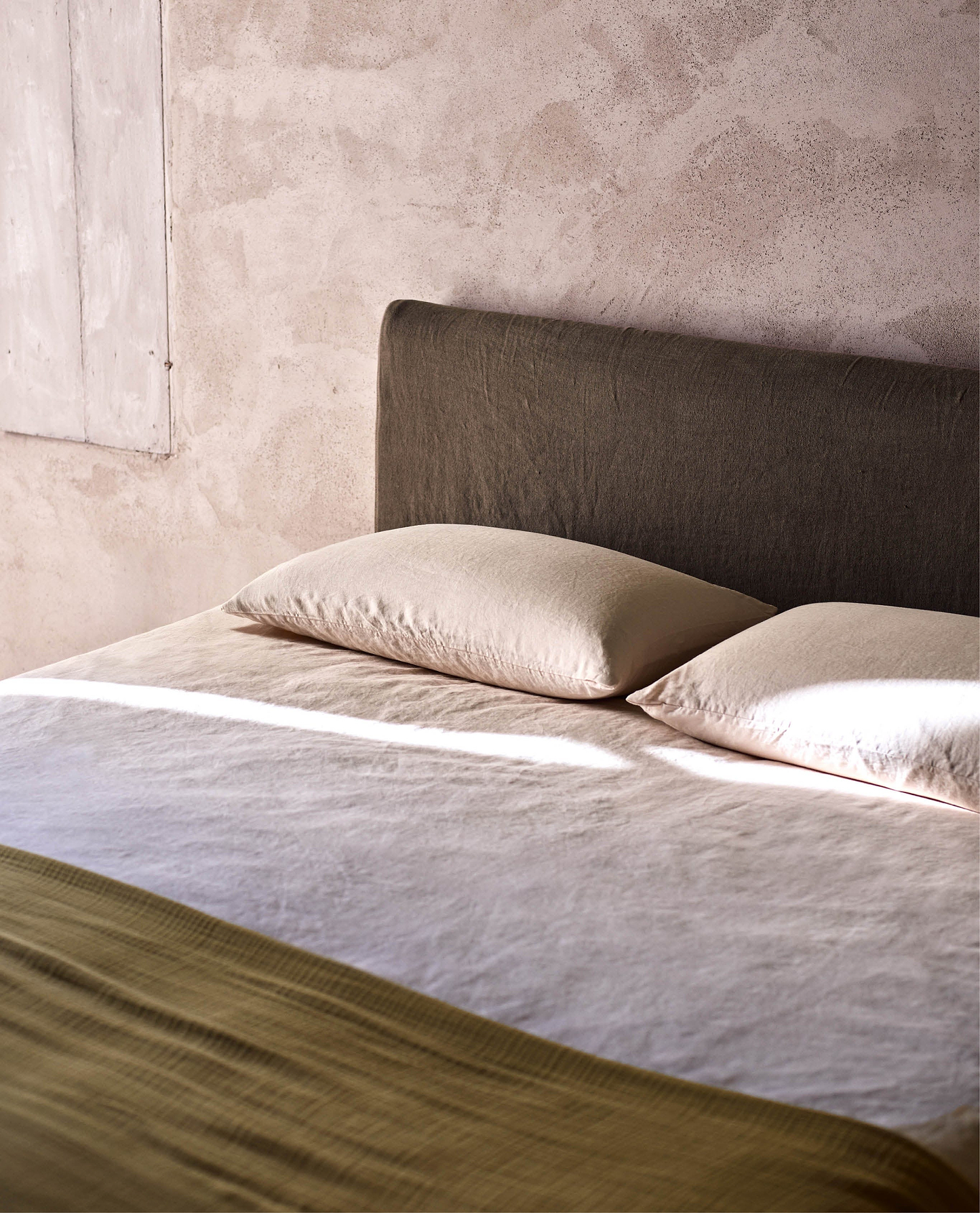 Image 5 of 6 showing Rise & Fall's House of Grey European Flax™ linen fitted sheet in peach.