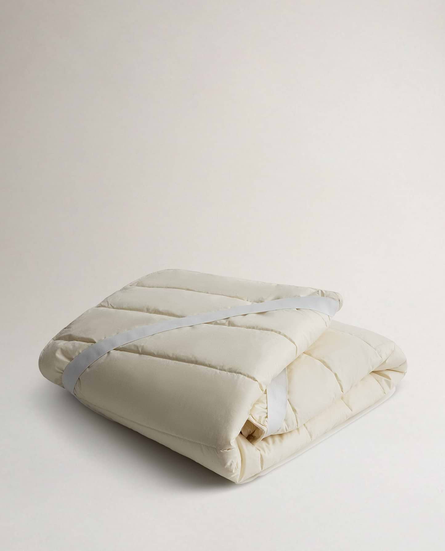 Rise & Fall's Luxury British Wool Matress Protector folded up.