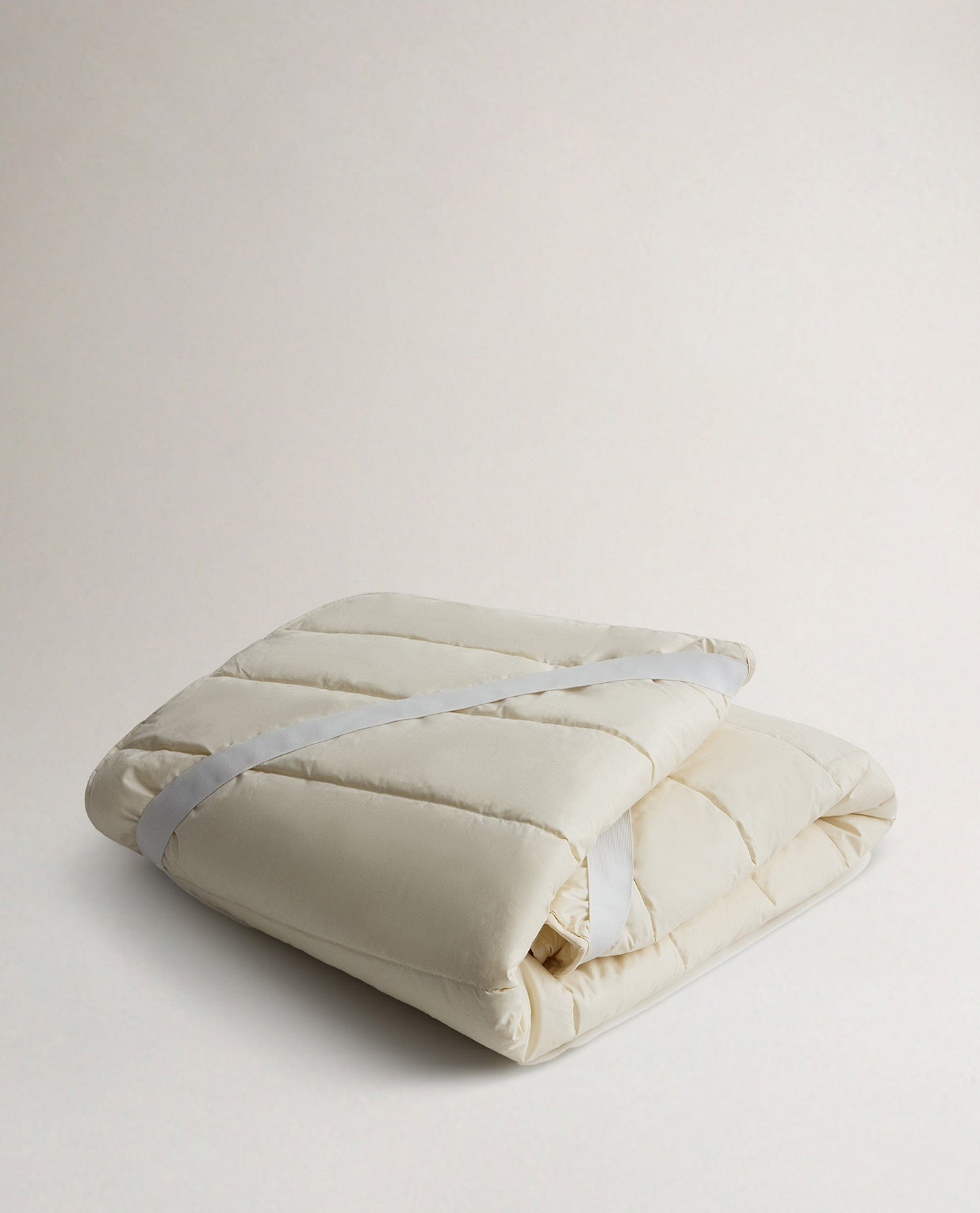 Rise & Fall's Luxury British Wool Matress Protector folded up.