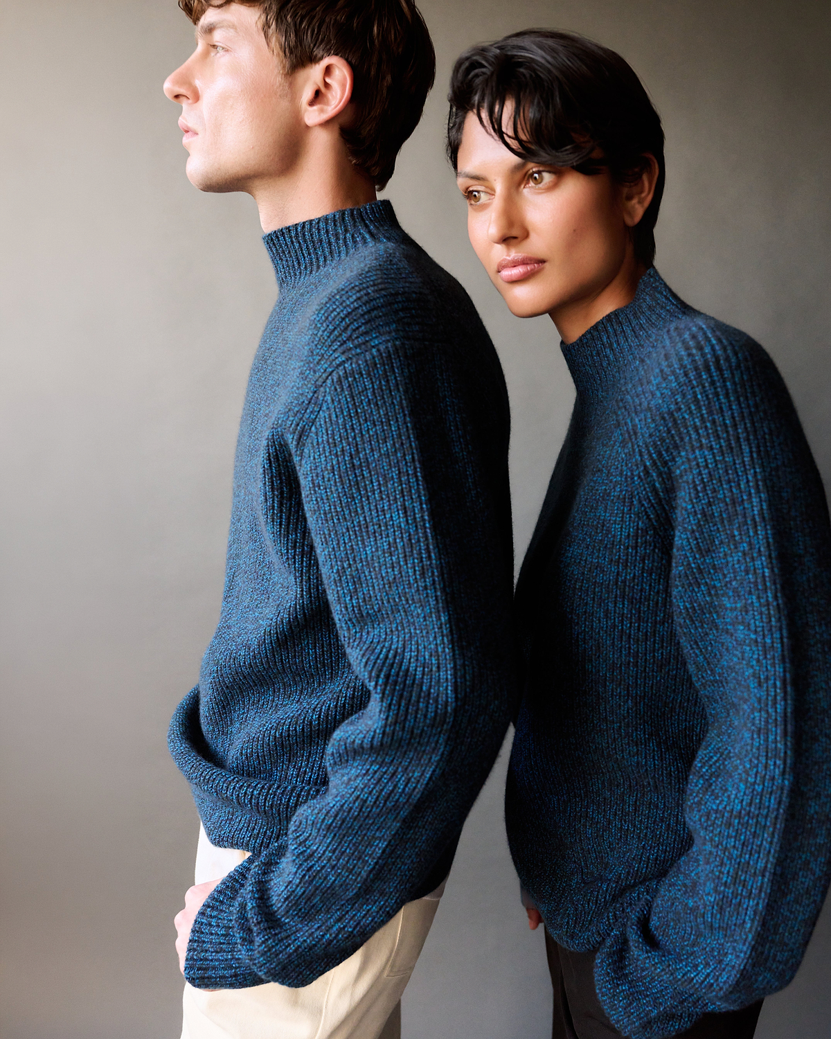 Man & Woman wear Rise & Fall crew neck jumpers.