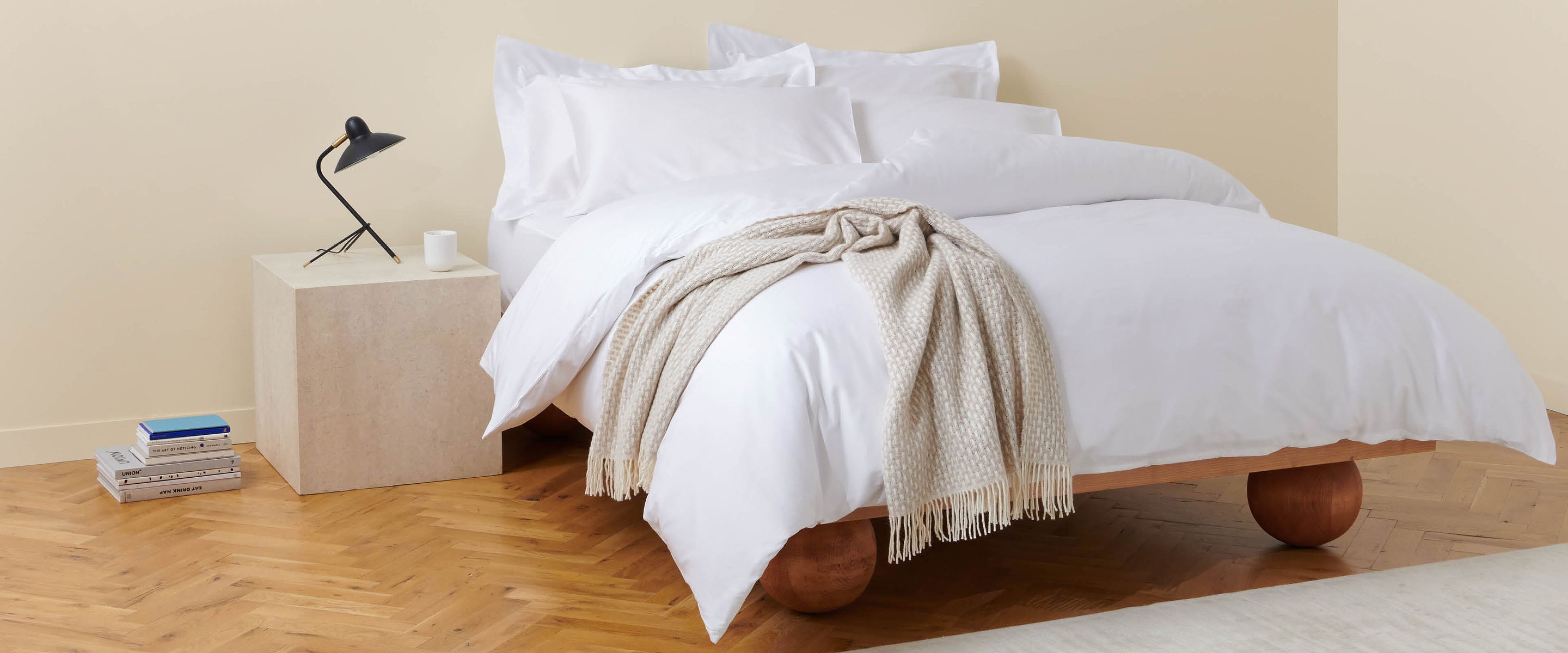 White Cotton Bedding Set With A Beige Throw