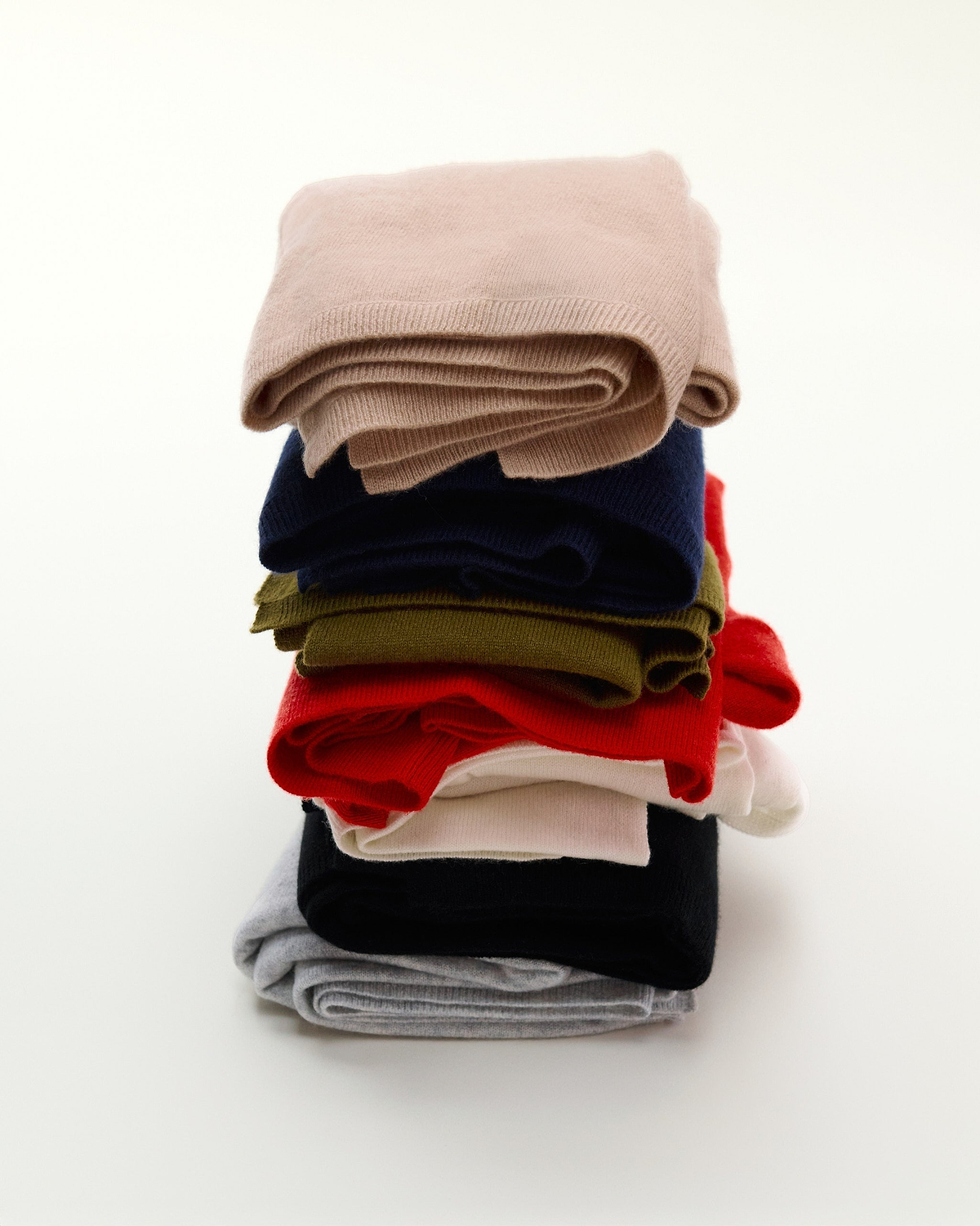 A Pile of Coloured Cashmere Wraps.
