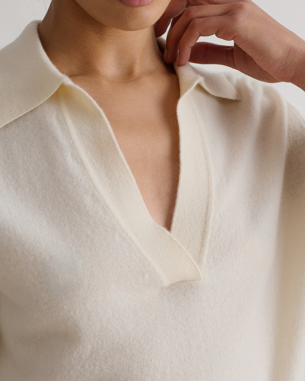 Women's lightweight cream cashmere v-neck top.