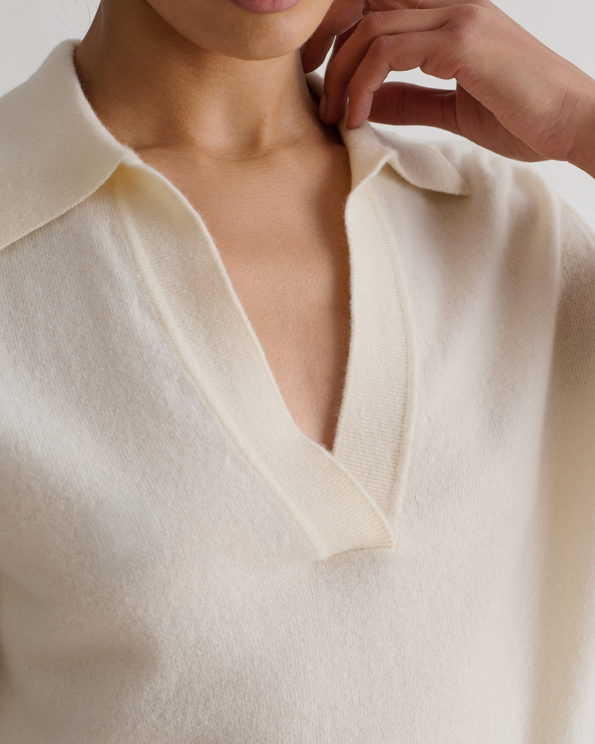 Women's lightweight cream cashmere v-neck top.