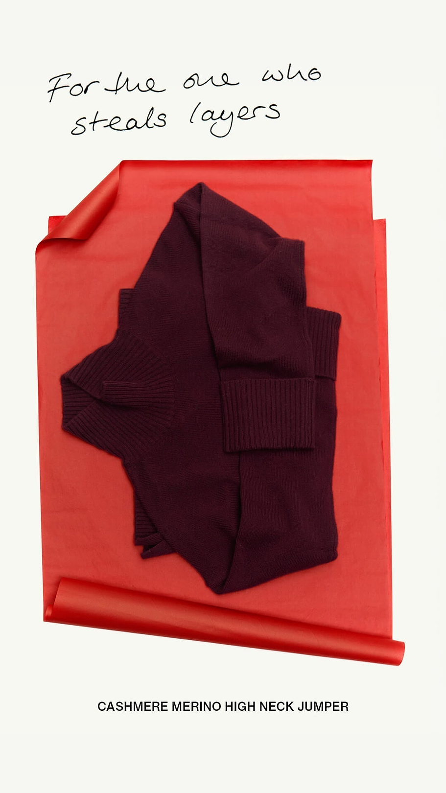 Rise & Fall's Oxblood cashmere jumper on red wrapping paper.
