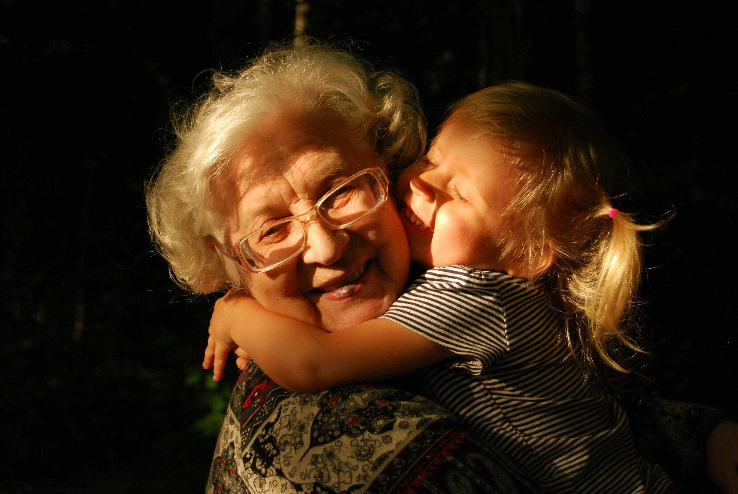 A Young Child Kisses Her Grandmother