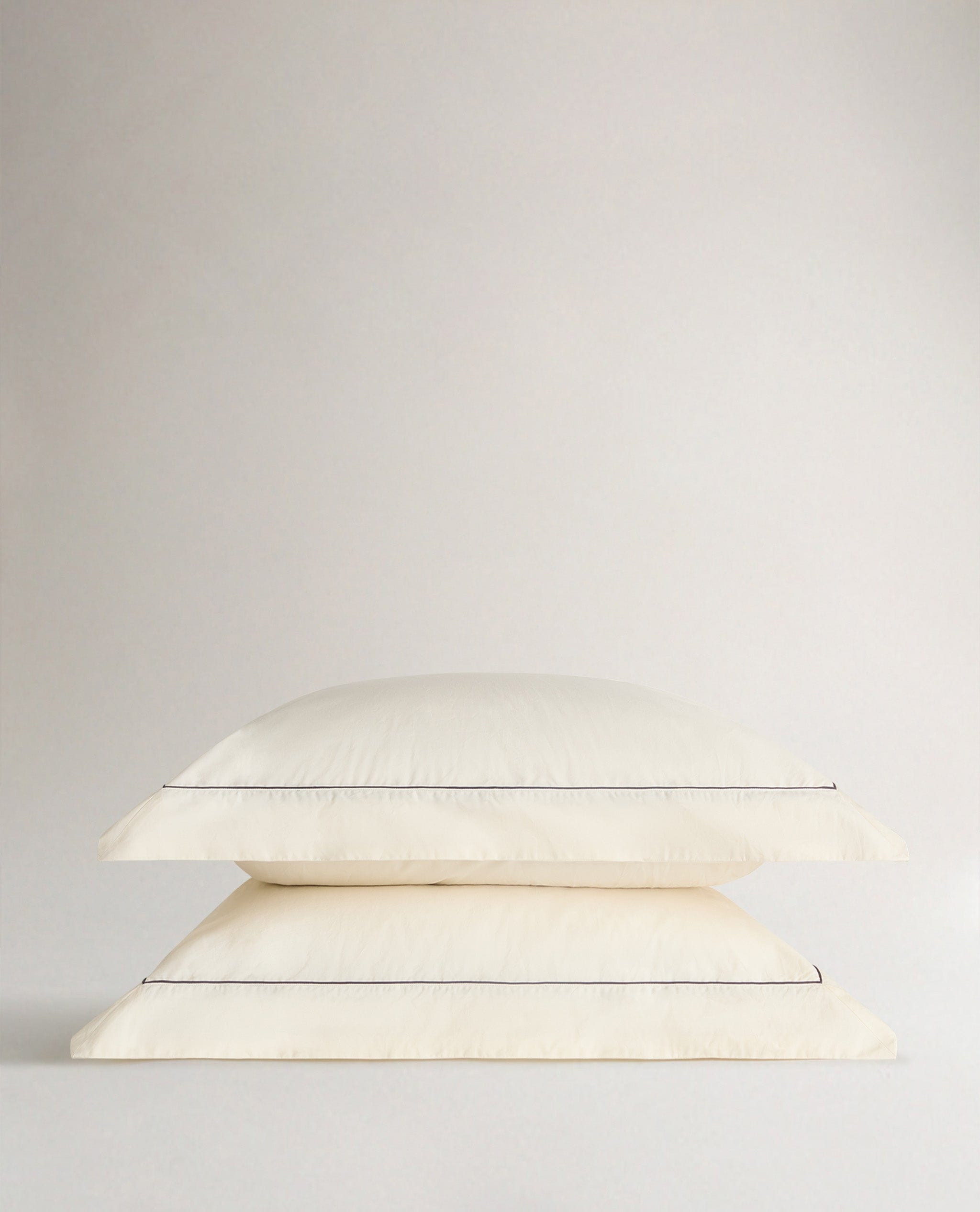 Crisp & Cool Organic Cotton Oxford Pillowcases - Buttermilk Black Piping