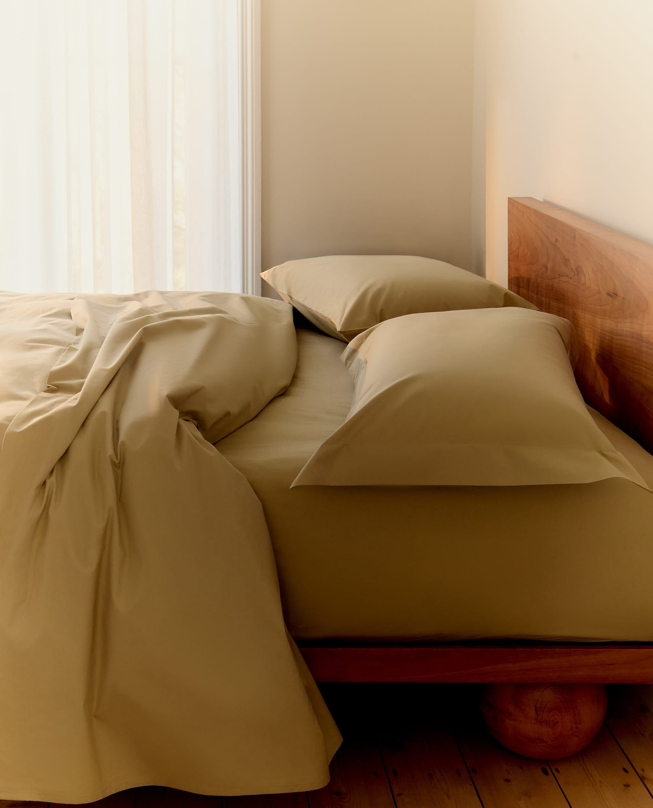 Bed Made With Rise & Fall's Cotton Percale Duvet Set in Sage. 