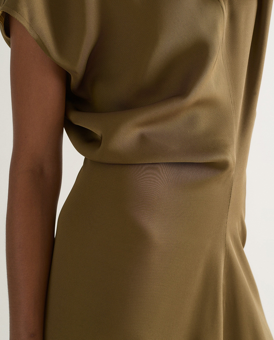 Close up of Rie & Fall's olive Naia™maxi dress.
