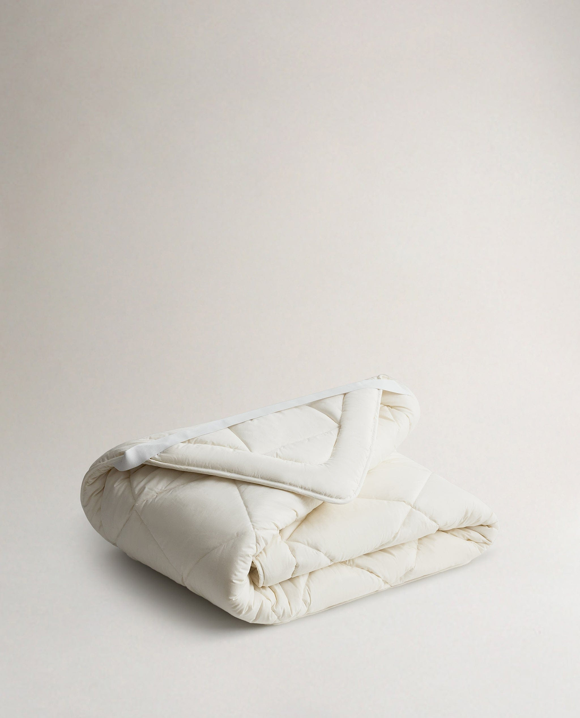 Image 1 of 2 showing Rise & Fall's  certified British Wool Mattress Topper.