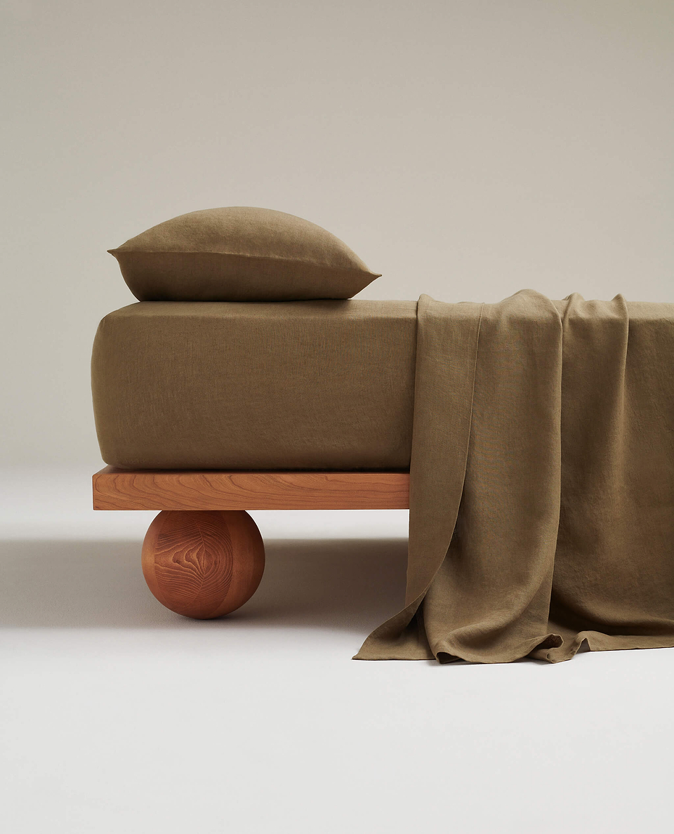 Image 1 of 3 showing Rise & Fall's Relaxed & Refined linen flat bed sheet in olive.