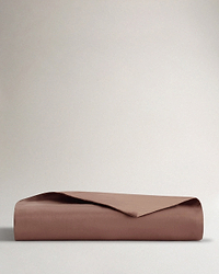 Image 1 of 3 showing Rise & Fall's sateen cotton duvet cover, colour: deep clay.