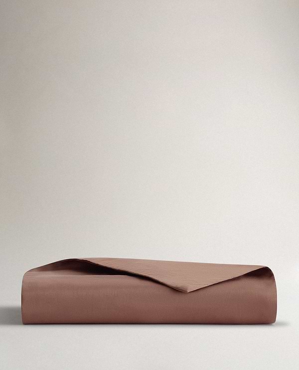Image 1 of 3 showing Rise & Fall's sateen cotton duvet cover, colour: deep clay.