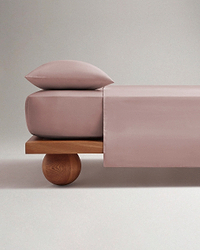 Image 1 of 4 showing Rise & Fall's Soft & Smooth organic sateen cotton flat sheet in deep clay.