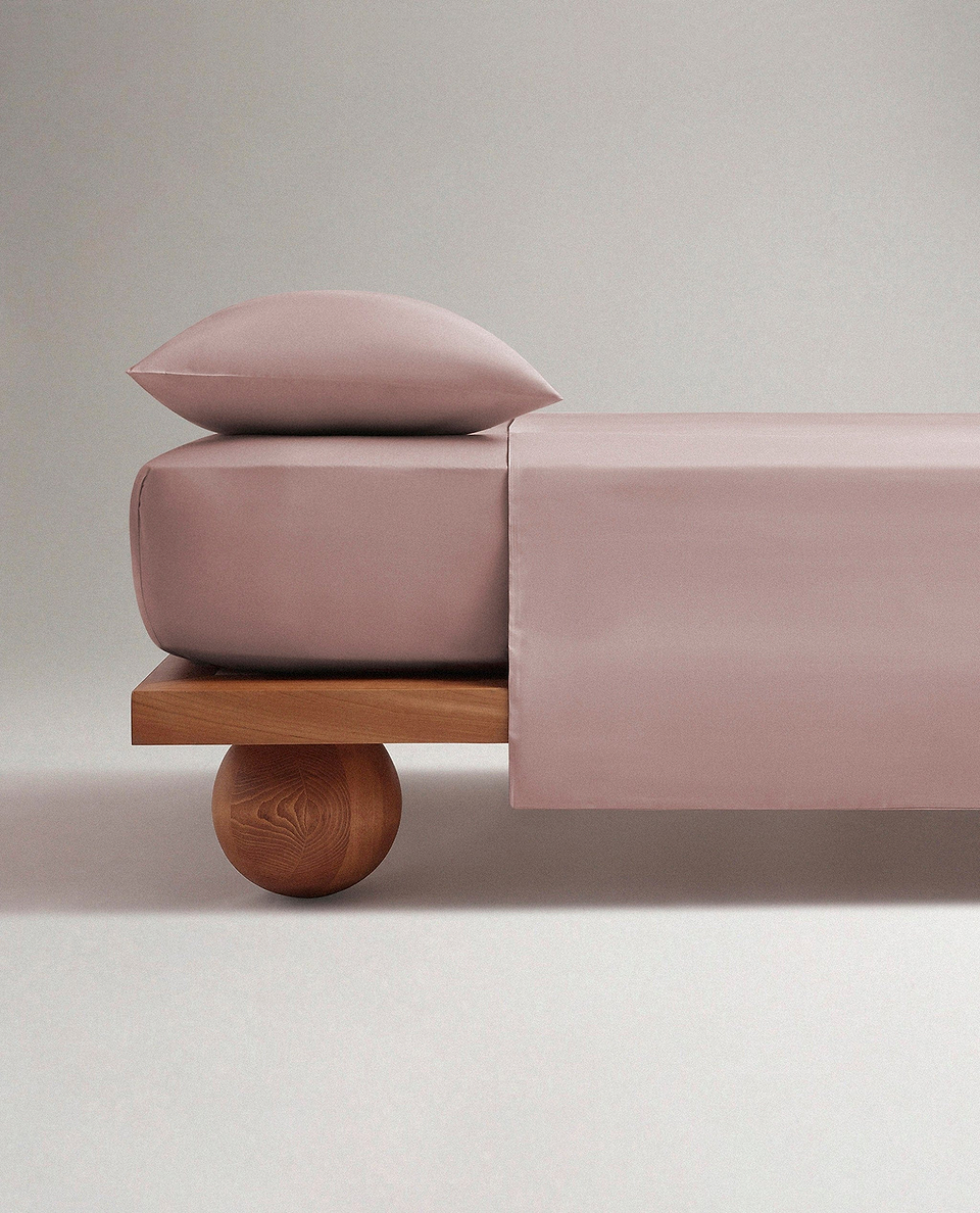 Image 1 of 4 showing Rise & Fall's Soft & Smooth organic sateen cotton flat sheet in deep clay.