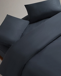 Image 1 of 4 showing Rise & Fall's Crisp & Cool organic cotton bedding set in indigo.