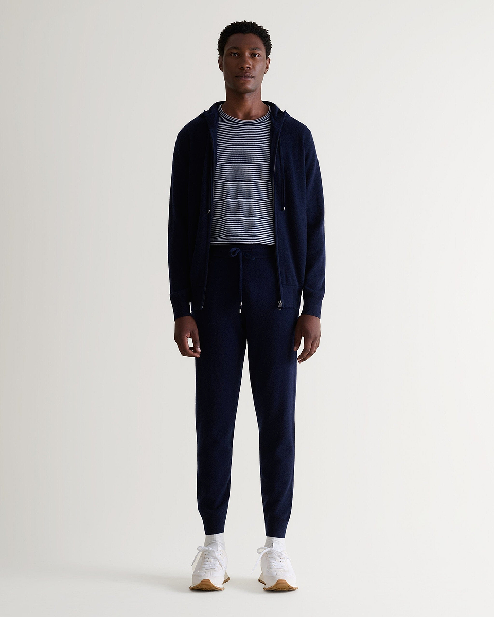 Image 1 of 5 showing man wearing Rise & Fall's fine cashmere jogger, navy.