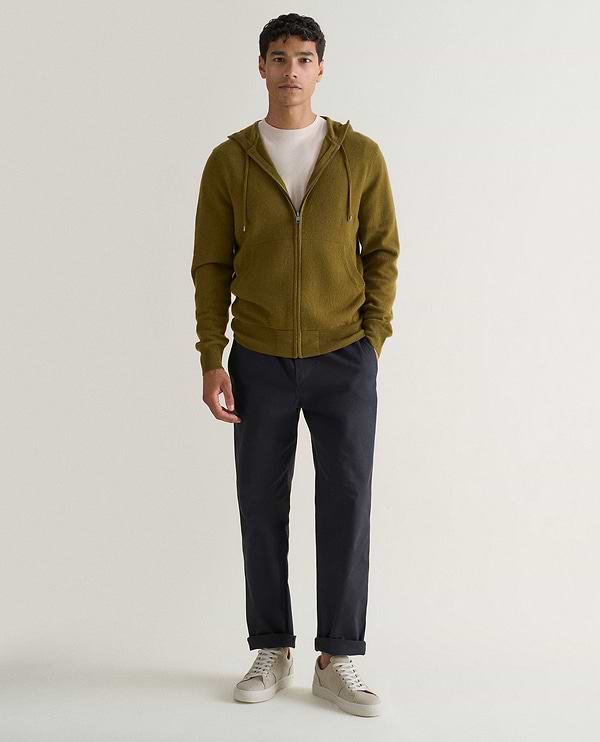 Image 1 of 5 showing man wearing Rise & Fall's Finest Cashmere Full Zip Hoodie in olive green.