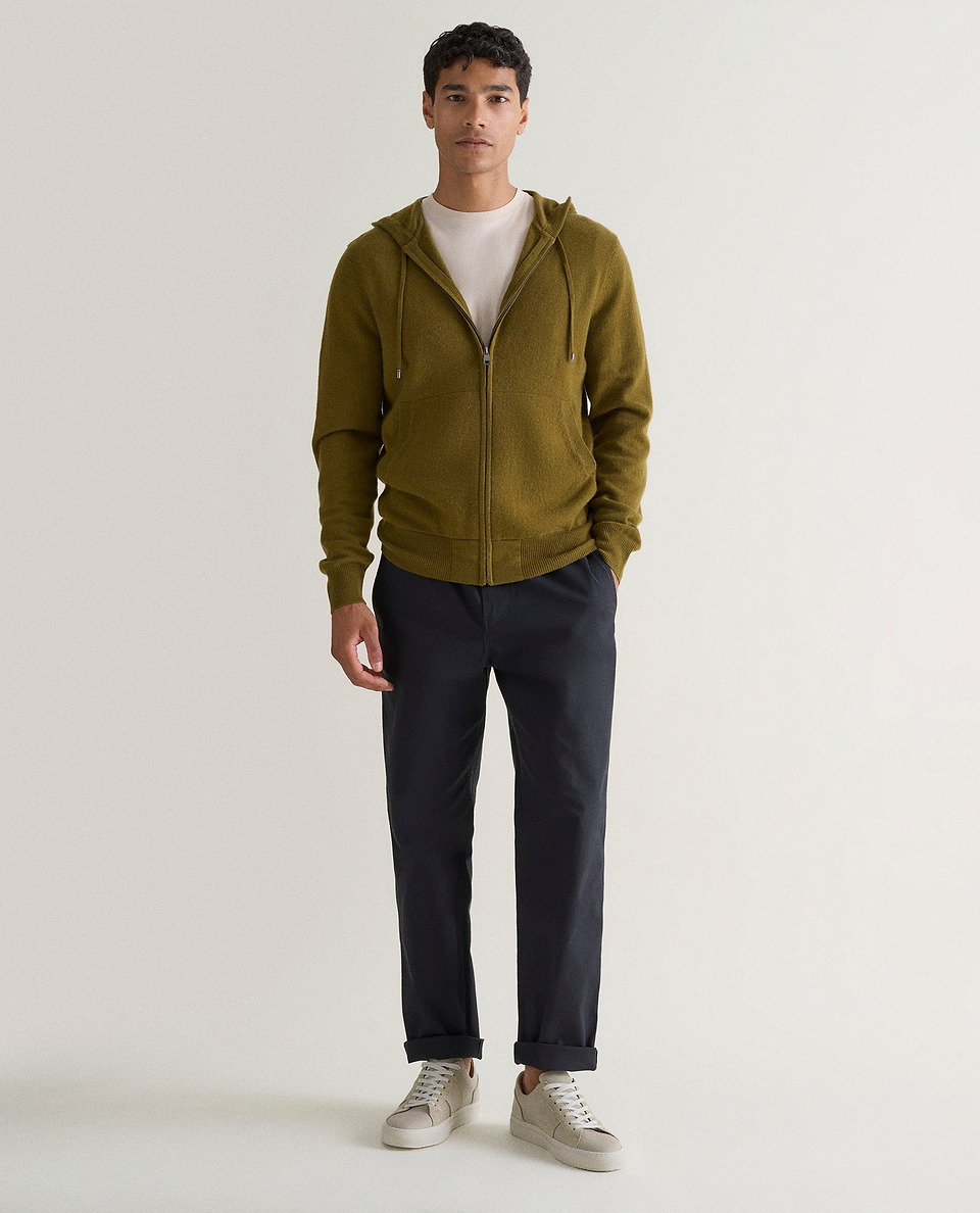 Image 1 of 5 showing man wearing Rise & Fall's Finest Cashmere Full Zip Hoodie in olive green.