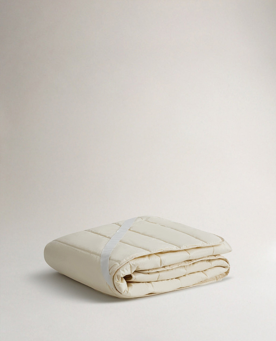 Image 1 of 5 showing Rise & Fall's certified British Wool Mattress Protector.