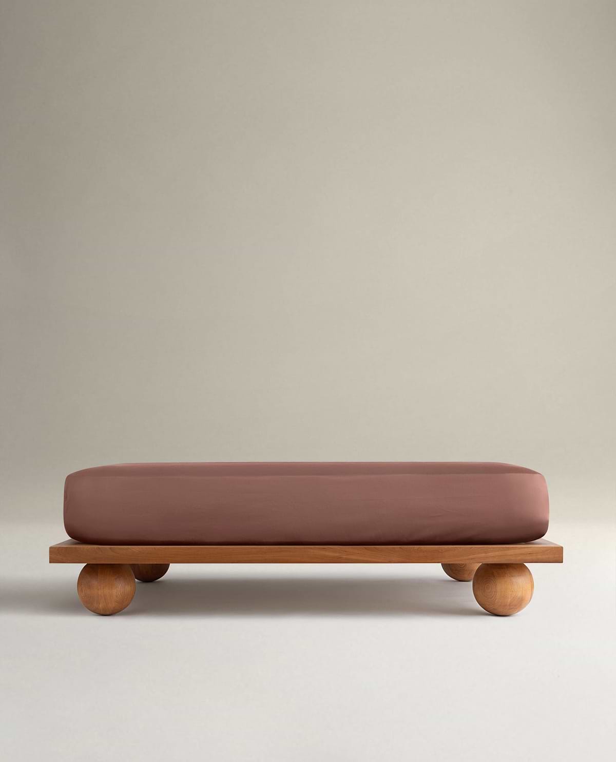 Image 1 of 5 showing Rise & Fall's Soft & Smooth sateen cotton deep fitted sheet in clay.
