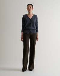 Image 1 of 5 showing woman wearing Rise & Fall's fine cashmere blouson cardigan, colour: graphite.